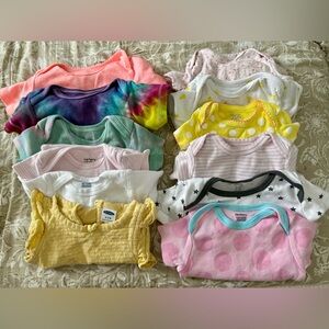 12 onesies various sizes